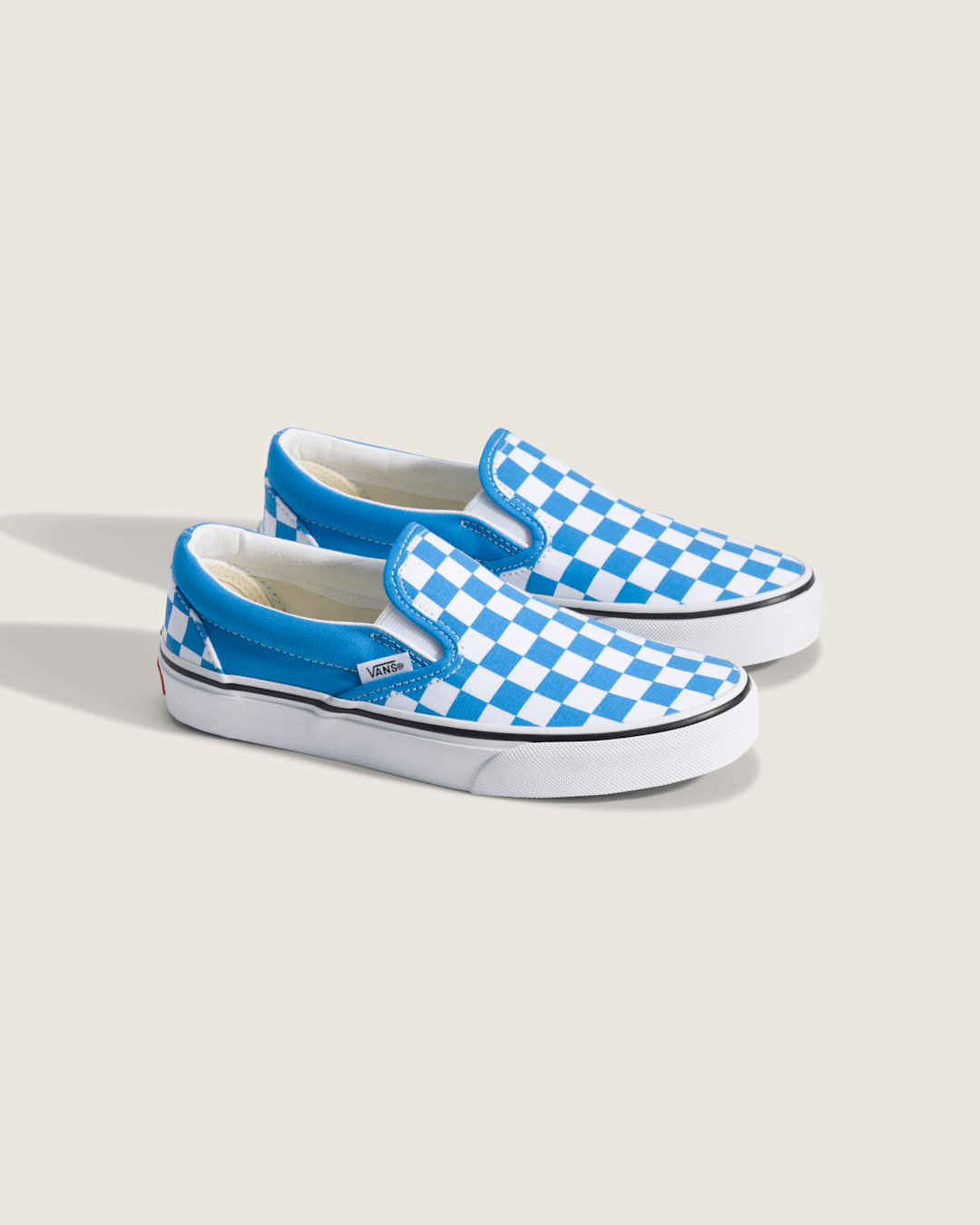 Vans Big Kids Classic Slip-On Checkerboard Shoe in Checkerboard Bright Azure Blue